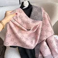 Thick cashmere-like double-sided shawl with pink and grey clover patterns on a chair - 185cm / Pink