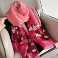 Detail of pink and burgundy gradient silk wool scarf with intricate floral embroidery - Gradient Watermelon Red