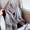 Silver silk wool shawl with metallic sheen on camellia hanger over gray sofa - 195CM / Gray
