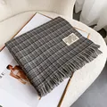 Detail of the soft plaid cashmere scarf with delicate tassels and brand woven label - Grey Black Beige Fine Plaid (Type F)