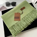 Solid grass green cashmere-like scarf with fringe details and leather label - Avocado Green