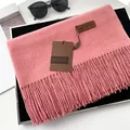 Pink cashmere style scarf with elegant fringe and Gerunsi brand tag on display - Extended Version / Dusty Pink