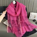 Detail of rose pink silk mohair scarf featuring gold stripe patterns and texture - Rose Red