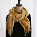Elegant mustard yellow plaid scarf with long fringe tassels on a black mannequin - 190cm / Japanese Yellow Plaid