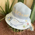 Close-up of kids light blue sun hat with dinosaur prints and breathable knit fabric - Blue