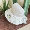 Detail of children's sun hat featuring breathable mesh crown and cute dinosaur prints - Gray