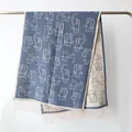 Navy blue and cream knit scarf featuring cartoon cat patterns and fringe edges - 190cm / Denim Blue