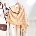 Classic checkered knitted scarf with tassels in mustard orange and cream white colors - Camel