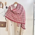 Detail of red and white geometric pattern knit scarf with white fringe and thick texture - Burgundy