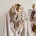 Close-up of knit camellia scarf with thick floral pattern and soft fringe tassels - New Camellia-Khaki
