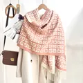 Detailed close-up of pink and cream geometric 4G pattern knit scarf with tassel fringe - Pink