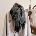 Close-up of thick camellia flower pattern scarf with elegant black tassels and texture - New Camellia-Black