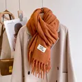 Solid ginger orange knit scarf with tassel fringe and minimalist label for winter - Caramel
