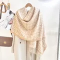 Beige and cream fringe scarf with geometric patterns on a wooden hanger - Light Beige