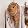 Detailed view of winter jacquard scarf featuring ethnic paisley patterns and tassel edges - Maya Pattern Camel