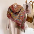 Detail of bohemian shawl with ethnic geometric patterns, tassels and thick knit texture - Maya Pattern Green