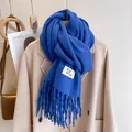 Royal blue knitted scarf with fringes and minimalist brand tag for winter - Sapphire Blue