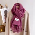 Thick solid color knit scarf in dark rose pink with fringe details and woven label - Cinnabar