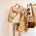 Detail of horse jacquard pashmina scarf with tassel edges on an autumn wool coat - 185cm / Galloping Horse - Yellow