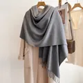 Classic grey wool scarf with fringe tassels worn with a beige winter coat for a stylish look - 185cm / Heather Grey