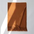 Close-up of caramel wool scarf showing delicate texture and handmade fringe tassels - 185cm / Caramel color