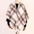 Close-up detail of soft plaid shawl texture with neat edge stitching for winter - Triangle Plaid Shawl / Beige