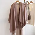 Mocha brown wool blend scarf with long fringe displayed on a beige wool coat - 185cm / Flax Khaki