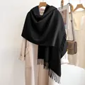 Classic black wool-blend scarf with fringe tassels paired on an elegant beige wool coat - 185cm / Black