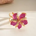 Gold-plated cuff bracelet with pink enamel floral design and metallic finish - Bangle / Rose Red