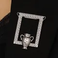 Detail shot of vintage silver flower vase brooch on black lace fabric with intricate textures - Arrangable Flower Frame Brooch (2712) / Silver