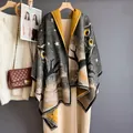 Knit owl print shawl wrap with stars and fringe detail on a wooden hanger - 185cm / Black