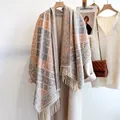 European plaid checkered scarf with tassels draped over a coat for an elegant winter look - Pink