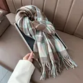 Detail of classic plaid scarf with fringe in brown, blue and beige knit texture - Blue