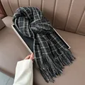 Classic plaid scarf with fringes in black, white, and brown for autumn and winter warmth - Black