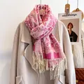 Close-up of pink floral jacquard pattern and long tassels on a warm winter scarf - 190cm / Rose Red