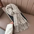 Classic beige checkered fringe scarf in soft cashmere-style knit for winter warmth - White