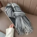 Close-up of thick plaid tassel scarf texture neatly folded on an elegant black tray - 188CM / Gray