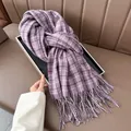 Detail view of purple plaid scarf with soft cashmere texture and elegant fringe edges - Purple