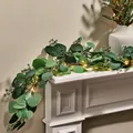 Artificial eucalyptus garland with warm LED lights draped on a white fireplace mantle - Standard Style (5473053674557)