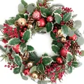 Close-up of Christmas wreath with red berries, pine cones, and snowy green holly leaves - 30CM Wreath