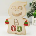 Wooden Halloween ghost decoration with BOO lettering and festive striped patterns - Ghost