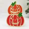 Halloween layered pumpkin wood ornament with orange and red tones and spooky faces - Pumpkin