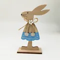 Easter wooden bunny ornament in blue painted dress with a jute bow on a white base - Rabbit in Blue Polka Dot Skirt (Style 9)