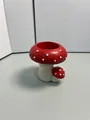 Portacandele a fungo in resina rossa a pois bianchi con base a trama verticale unica - Stile Portacandele Fungo