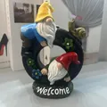 Garden gnome ornament with two dwarfs climbing a tire and snail on a Welcome base - Tire Welcome Gnomes