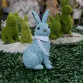 Blue resin rabbit ornament with woven wicker texture and a white ribbon bow decor - Blue Sitting Style