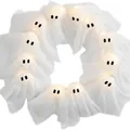 Halloween lit ghost wreath with 10 glowing warm white fabric ghosts for festive decor - Light-up