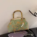 Pale green floral jacquard bag with bamboo handle and pearl chain strap detail - Green