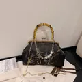 Retro bamboo handle bag with black floral embroidery and elegant pearl metal chain strap - Colorful Bamboo