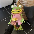 Handmade crochet frog crossbody bag in green with pink overalls and leather strap - Pink